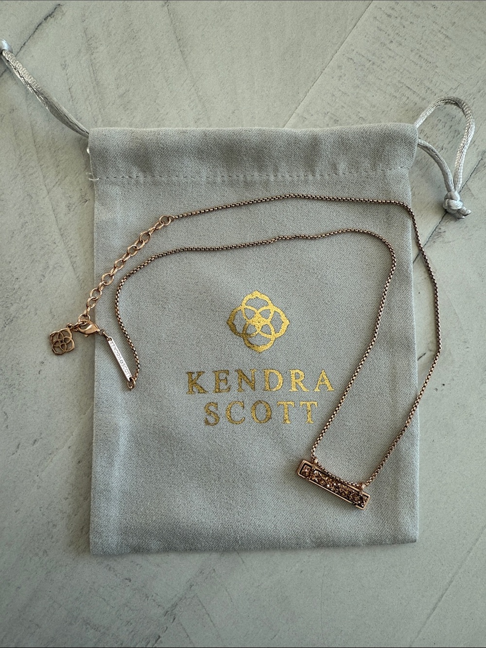 Necklace on Kendra Scott pouch